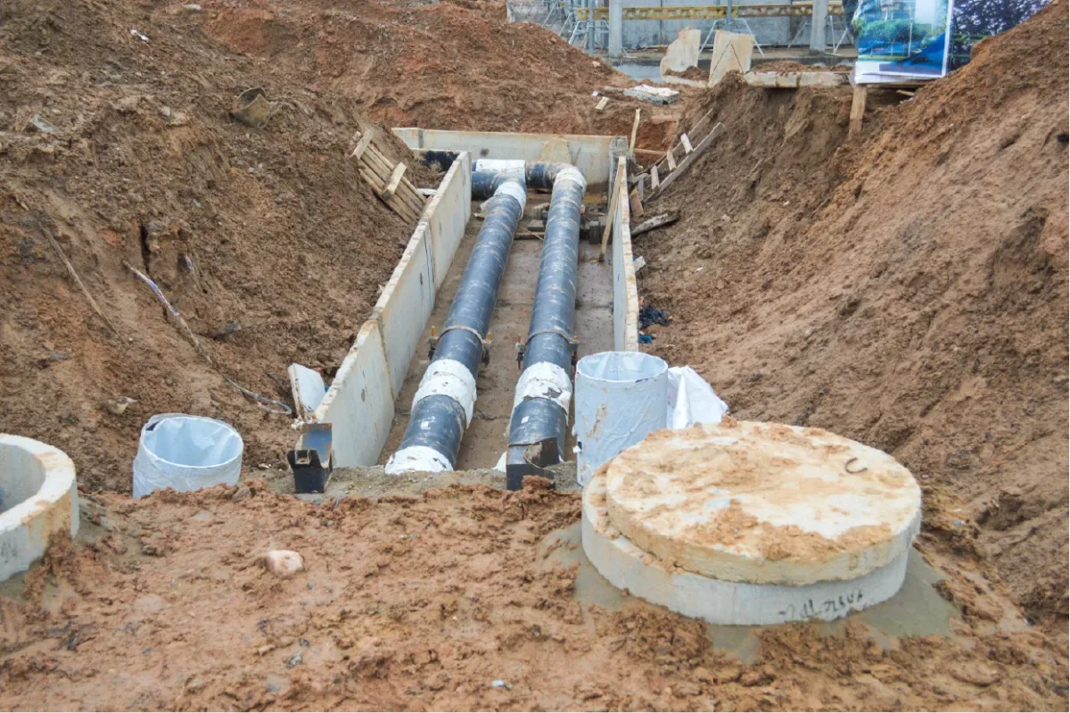 Industrial sewer line installation in a trench